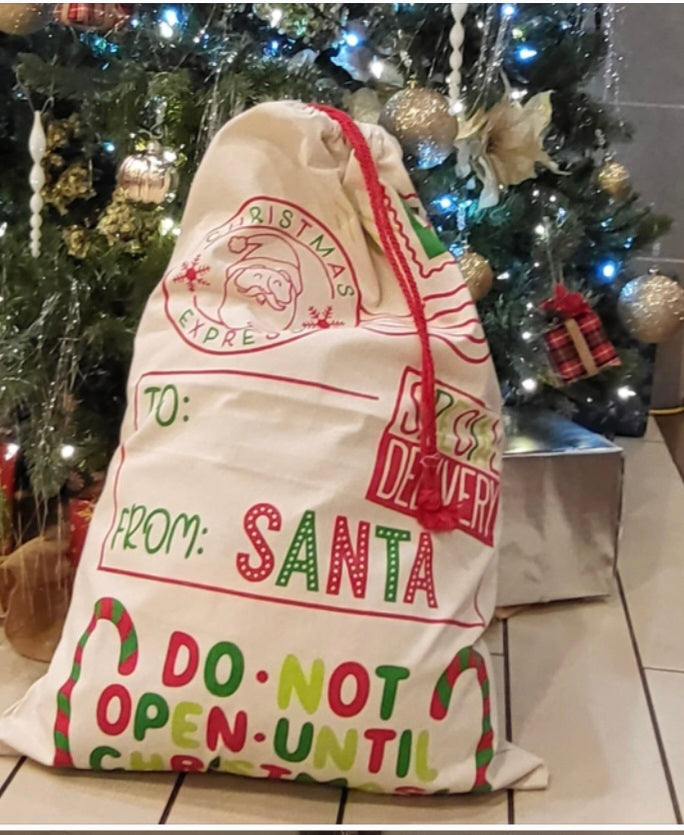 Santa sack design may vary. All sacks are the same size and personalized.
